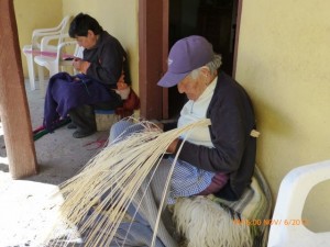 A women who still makes her living weaving hats!